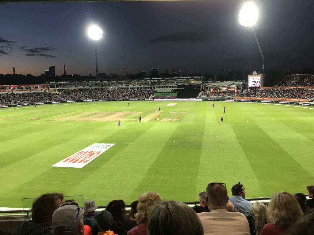 A Hundred match takes place under flood lights at a busy Edbaston cricket ground.
