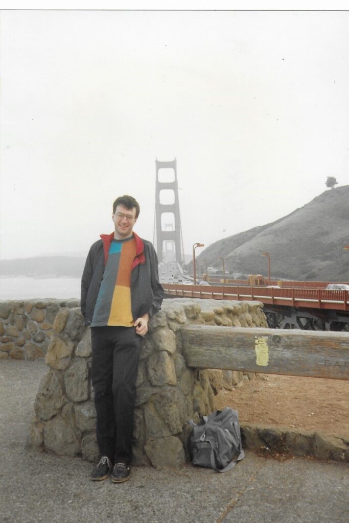 The author stands near the start of the Golden Gate Bridge.